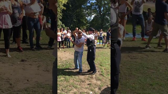 Lady Police Officer Dancing Salsa In The Park ,   London .
