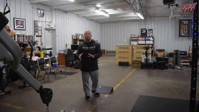 Heels Elevated Cable Zercher Squat - THIRSTgym.com
