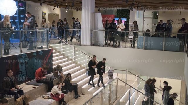 People walking down stairs in business center смотреть онлайн