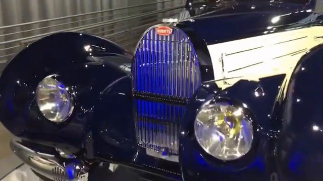 Enjoying the Bugatti car collection at the Bugatti party. смотреть онлайн