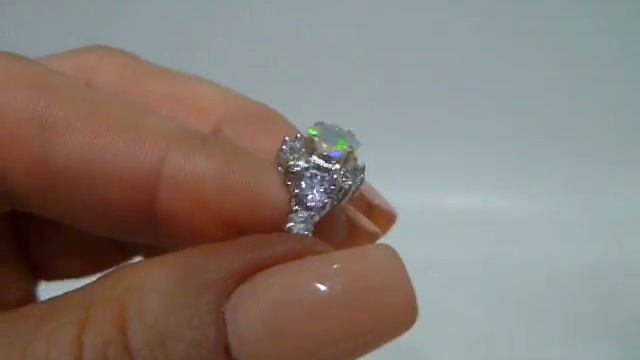 кольцо с эфиопским опалом 0.63 сt (кушон) и топазами смотреть онлайн