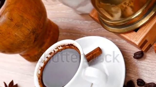 Stock Footage Sweet Hot Drink Black Turkish Coffee Small White Mug With Mortar Coffee Beans In Whit