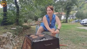 BBQ. Meat on fire. Cooking in a mountain village. Mila naturist.