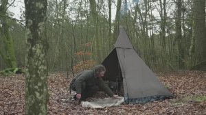 BERTRAN  - canvas tent and wood stove next to large lake, making firewood, cooking etc.