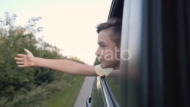 Teen Boy Looking Out the Car Window and Waving His Hand | Stock Footage - Videohive смотреть онлайн