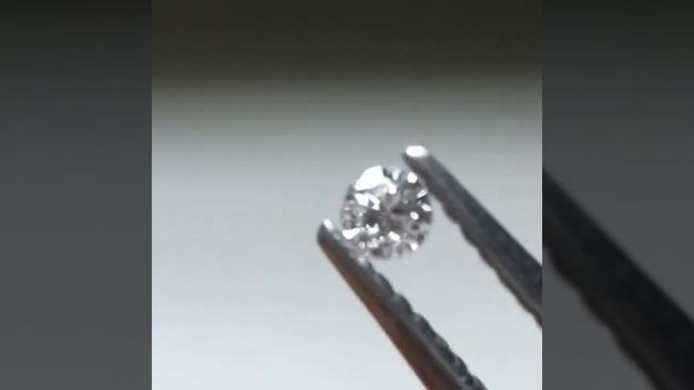 0.015 Carat Faint Blueish Grey Round Brilliant Diamond
