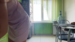 Tina in transparent dress cleaning in the home