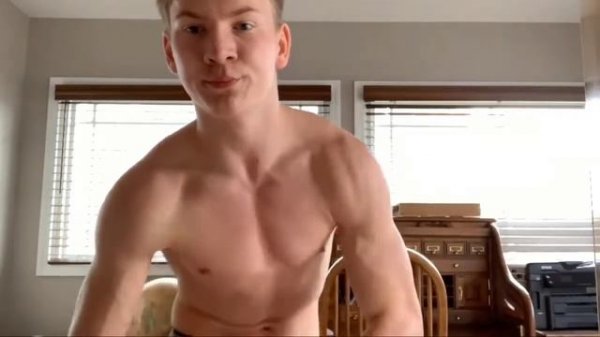 Young boy flexing muscles