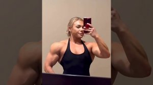 Beautiful muscular woman flexing muscles