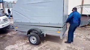 Видеообзор легковой прицеп ССТ 06 с подъемными бортами и аэротентом.