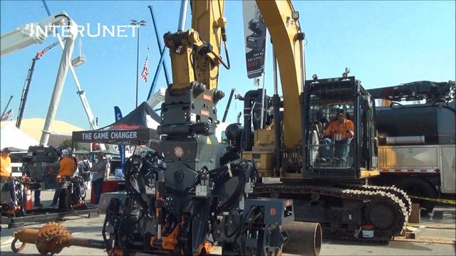 Caterpillar Excavator With OilQuick Coupler System Adjustable Utility Arms Demonstration