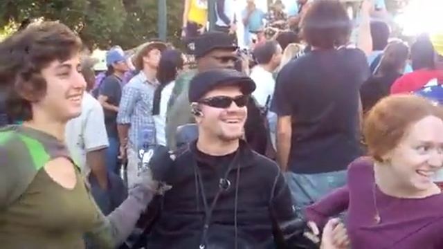 Dancing While Michael Moore Is Mobbed By Media