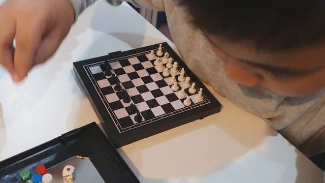 My son trying to teach me how to play chess. смотреть онлайн