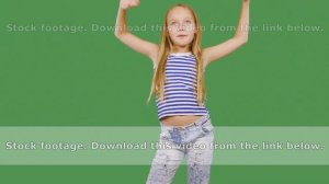 Young girl model posing front camera on green background. Girl teenager smiling and looking to