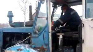 Запуск трактора Т-150К с двигателем СМД-62 при помощи «пускача» со стартером.