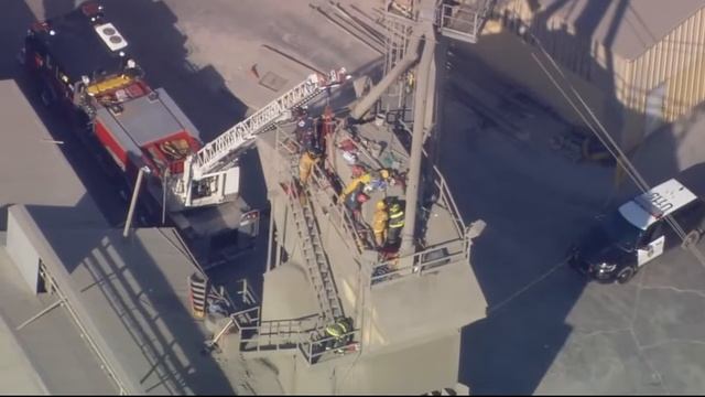 Firefighters rescue man trapped in cement hopper смотреть онлайн