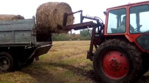 ЮМЗ в работе с погрузчиком на заднюю навеску