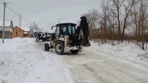 Экскаватор погрузчик Hidromek чистит снег в Белгороде на spetskran40.ru