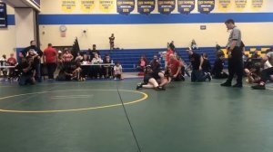 Girl wrestler beats boy with round 2 pin.