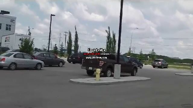 A Hino Shippment Truck Starting up and Driving Off From the Costco Store South Edmonton смотреть онлайн