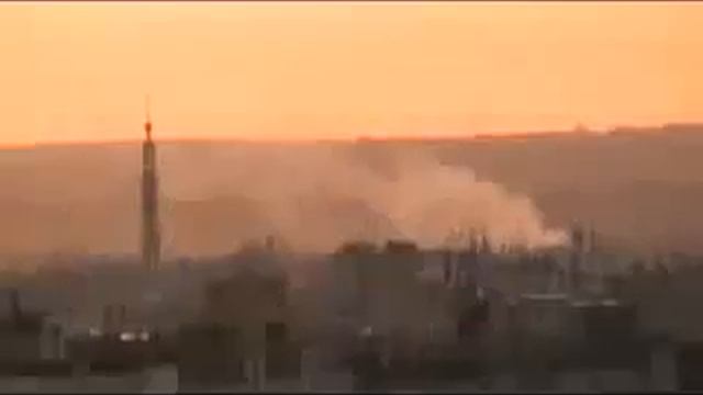Syria - Homs - Baba Amr - 20111109 - Smoke rises up above the houses - 2 смотреть онлайн