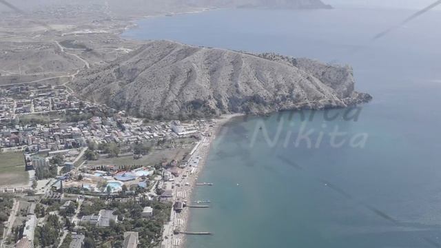 D-Log. Sudak, Crimea. Embankment of Sudak. Black sea coast with beaches, Aerial View смотреть онлайн