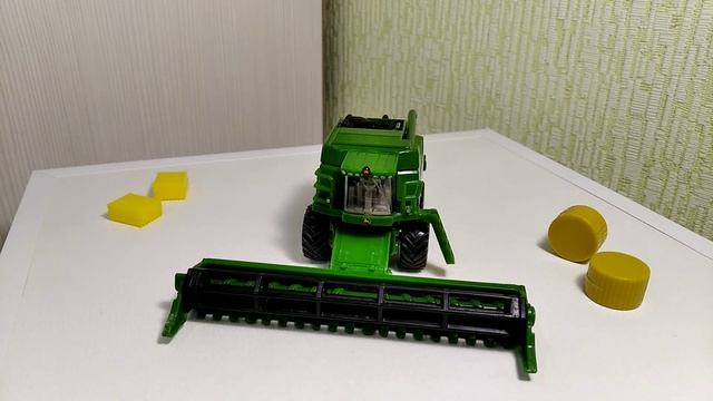 Зерноуборочный комбайн John Deere T 670i масштаб 1/87 Siku смотреть онлайн