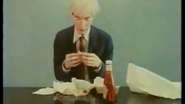 Andy Warhol Eats A Hamburger.