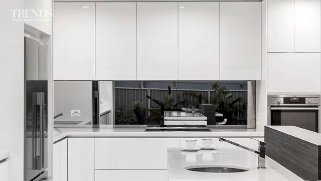 Sleek contemporary entertainers' kitchen with separate scullery and decorative waterdrop splashback смотреть онлайн