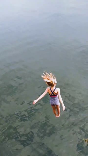 Young girl is jumping from high cliff in Hammersø Bornholm DK😱 смотреть онлайн