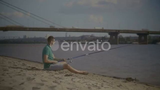 Relaxed Man with Spinning Rod Fishing on River | Stock Footage - Videohive смотреть онлайн