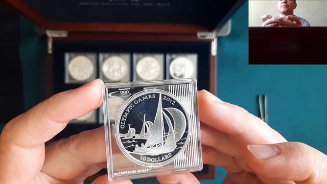 Olympic Games from around the world. Collection of silver coins in red boxes Колекція монет коробка смотреть онлайн
