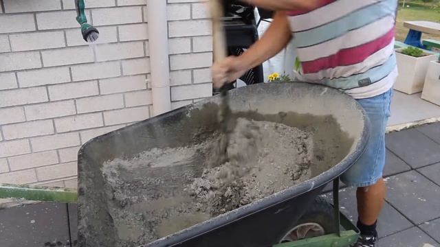 Mixing concrete by hand in a wheelbarrow ( Fast and very cheap way ) смотреть онлайн
