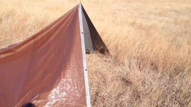 Tarp setup on the Plains allows for camp fire and blocks wind. смотреть онлайн