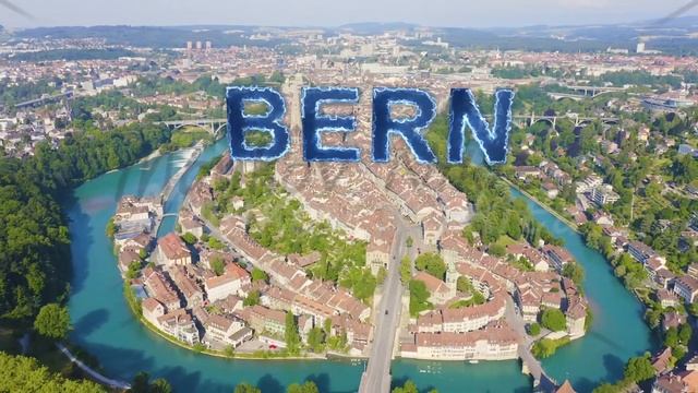 Inscription on video. Bern, Switzerland. Historic city center, general view, Aare river. Blue light смотреть онлайн
