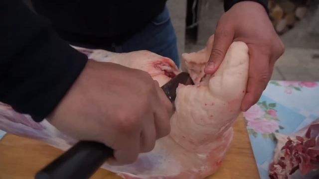 MEAT WITH VEGETABLES COOKED IN A POT ON OPEN FIRE.