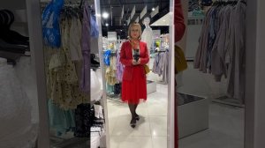 Young crosdresser dressed in red skirt