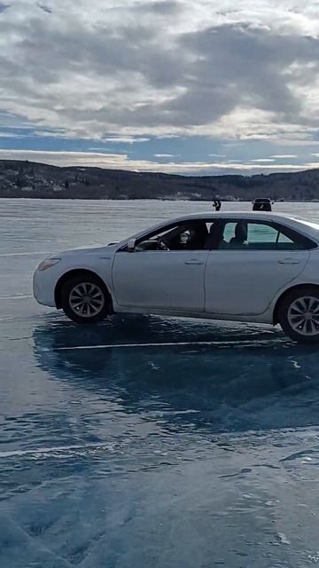 Driving On Frozen Ghost Lake, Calgary, Alberta. Canada.