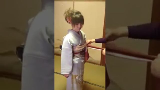 Foundups.com: My wife putting on a kimono for a friends wedding.