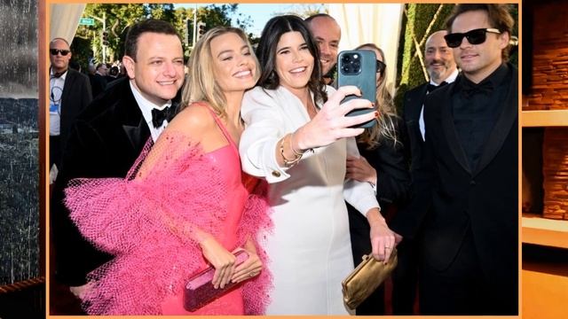 Margot Robbie channels Superstar Barbie in pink sequined gown and boa at Golden Globes 2024 смотреть онлайн