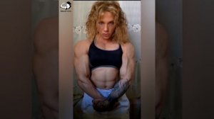 Gorgeous muscular woman flexing biceps