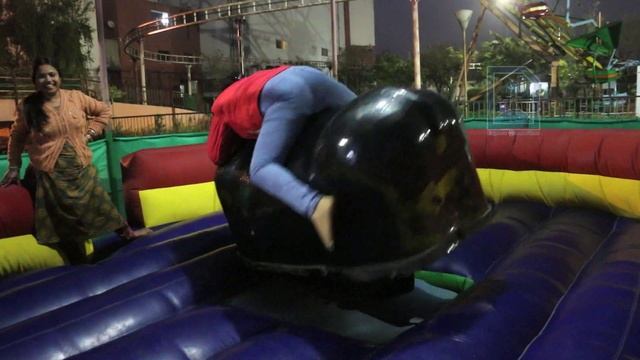 Woman rides the mechanical bull at Savin Kingdom Park, Siiliguri смотреть онлайн