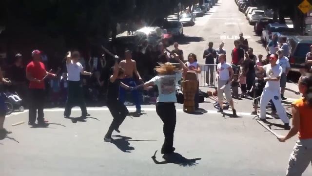 Two women do awesome machete fight dance in the street смотреть онлайн