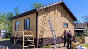 Отделка каркасного дома фасадными панелями под камень!