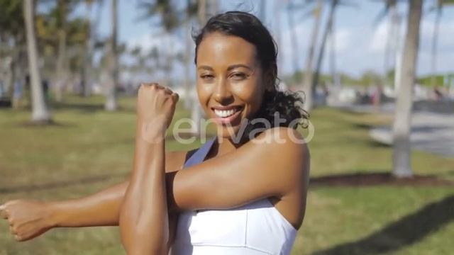 Content Black Girl Stretching Hands in Park | Stock Footage - Videohive