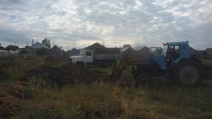 погрузка земли куном трактор беларус