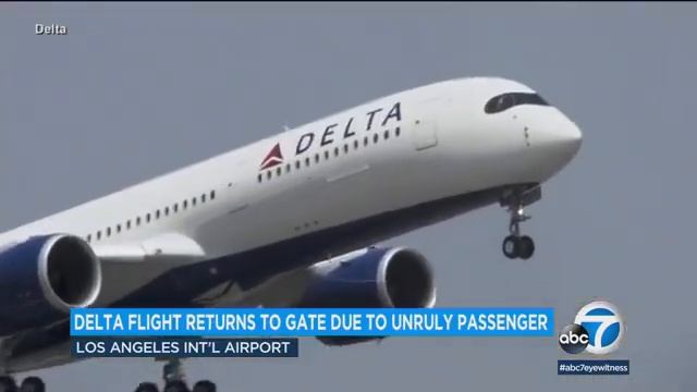 Delta flight passenger detained after opening emergency door moments before takeoff, airline says смотреть онлайн