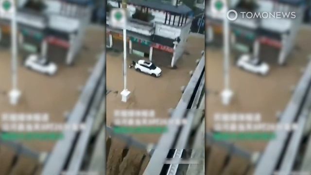Chinese Floods Turn Bridge Into Dystopian ‘Waterfall’