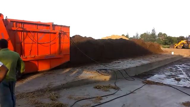 MUSHROOM COMPOST TURNER WITH WATERING ARRANGEMENT
