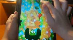 Играю в игру Cut the rope 2 (Ам ням). Пройденные уровни (69-72) и заработал 3 медали.
